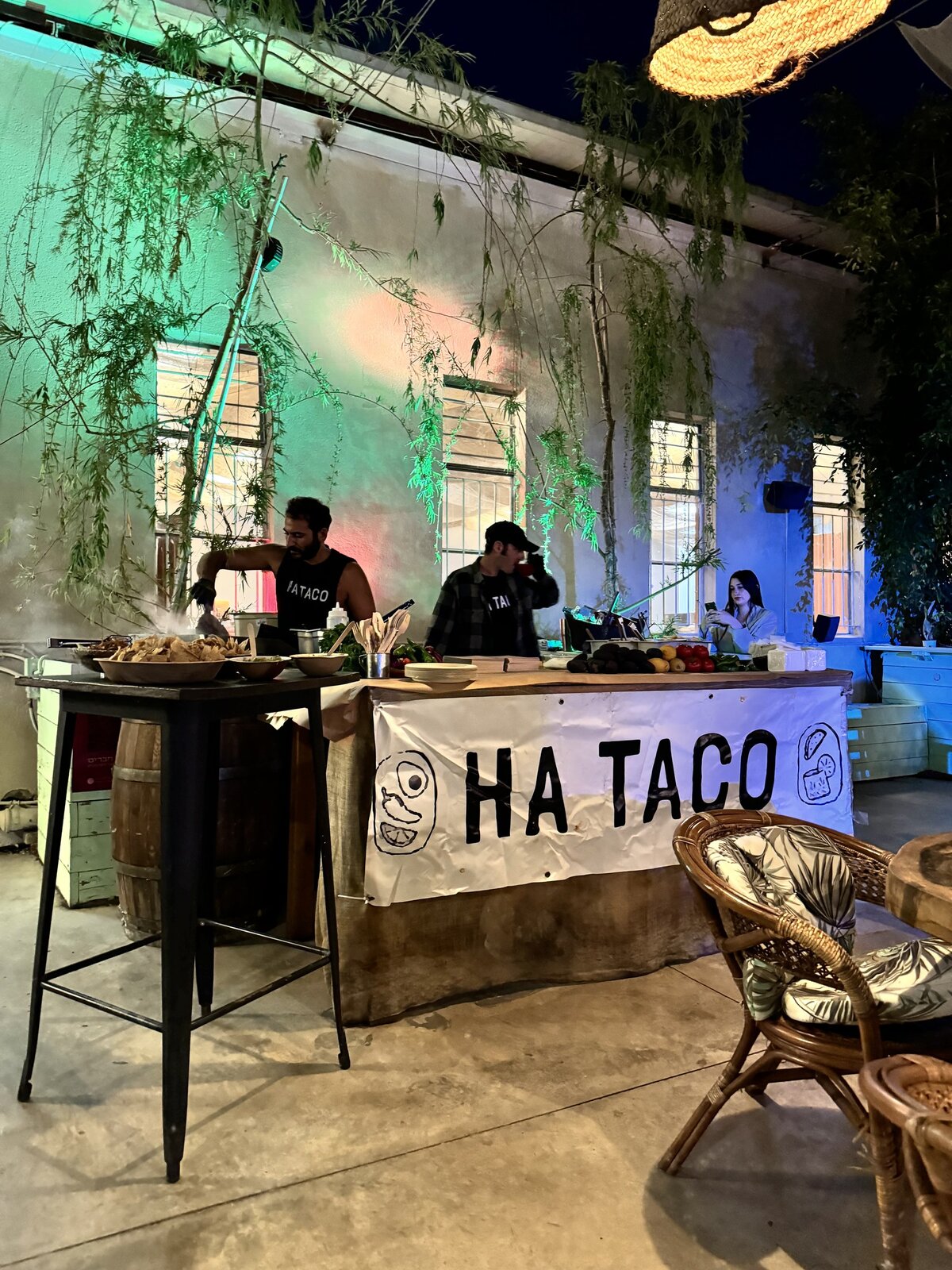 Evening courtyard event with coloured lighting